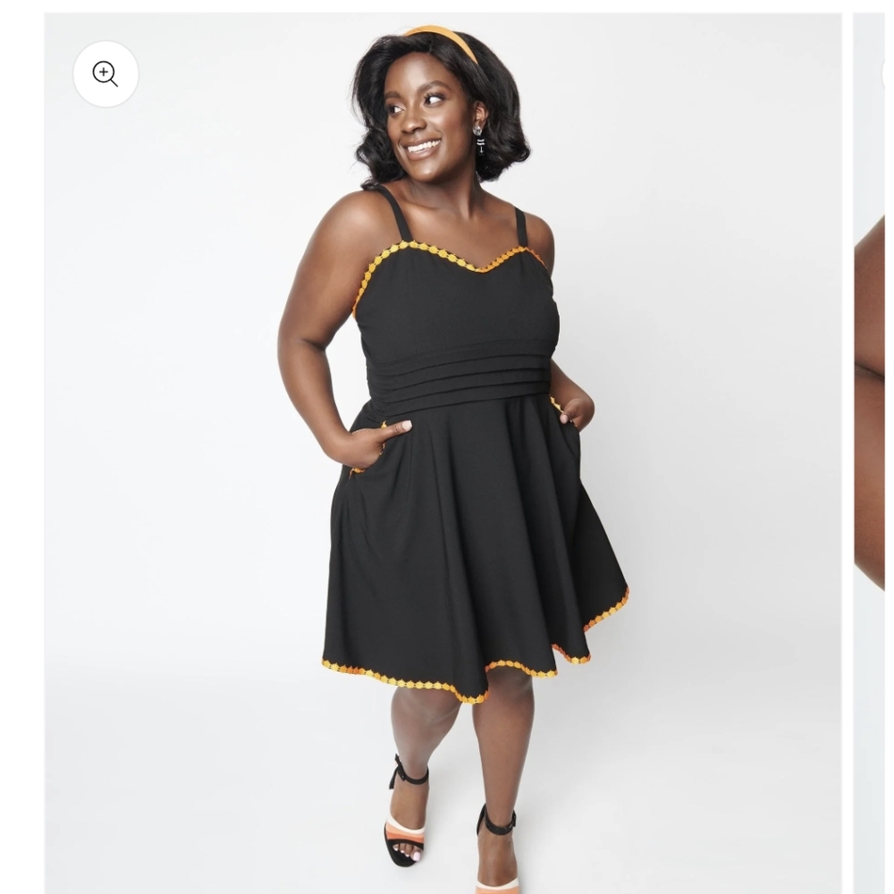 Black fit and flare dress with pumpkin trim